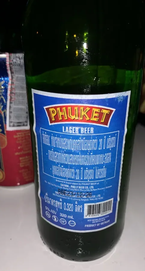 A standing Phuket Lager bottle